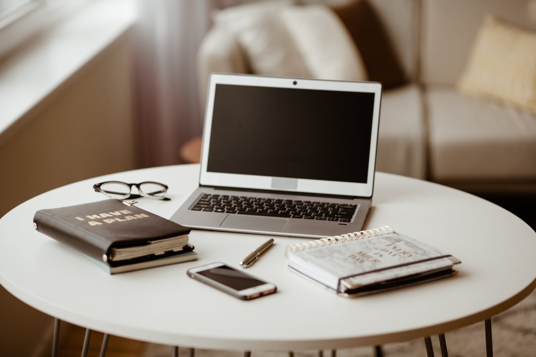 macbook air on white table